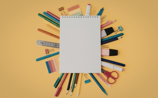 Stationery supplies including notebooks and pens